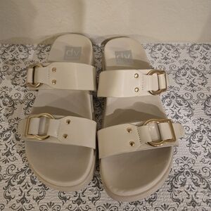 Dolce Vita Cream Sandals with Gold Buckles
